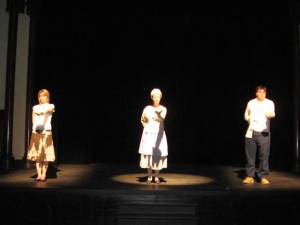 3 actors holding lettuce to further understand their characters.