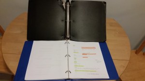 Old black script binder vs. new blue script binder